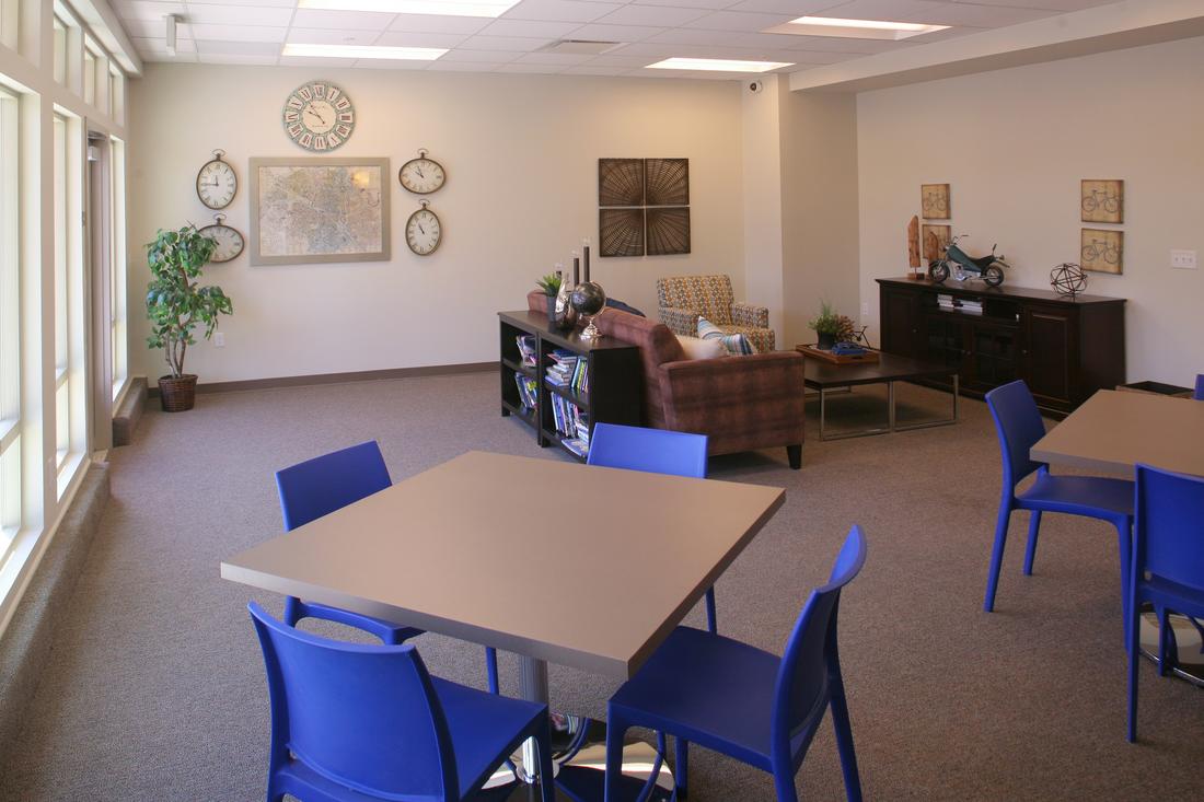 a room that has a table and chairs in it.