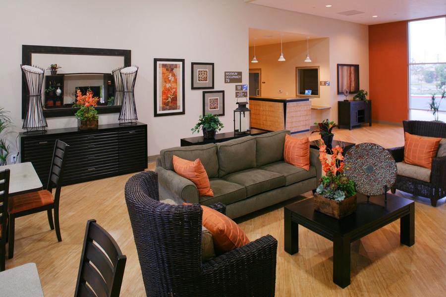 a living room filled with furniture and a flat screen tv.